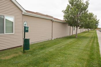 Lush green dog park at Country Meadows Apartment Homes.